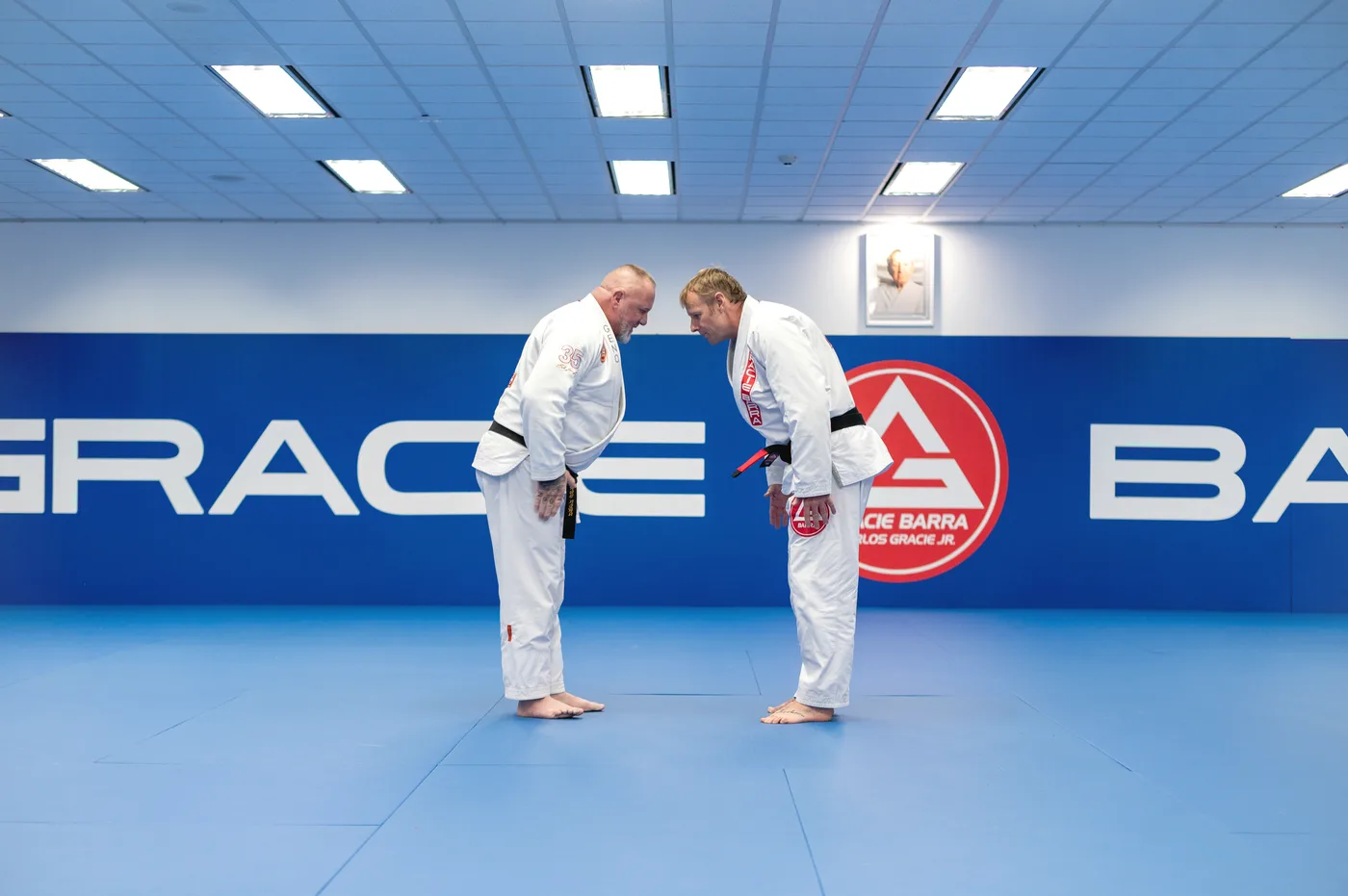 Two adult students bowing before a Jiu-Jitsu session at Gracie Barra Bakersfield